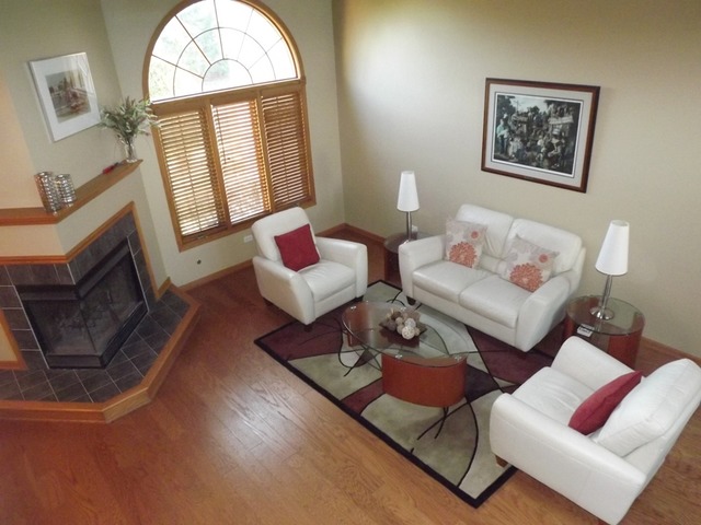 180 Grove Court, Unit 180 Lemont, IL 60439 - Photo 2 of 22 a living room with furniture a rug and a window