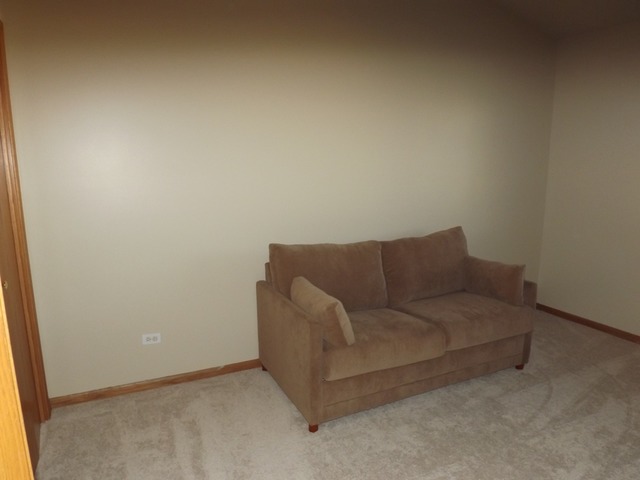 180 Grove Court, Unit 180 Lemont, IL 60439 - Photo 15 of 22 a living room with furniture and a window