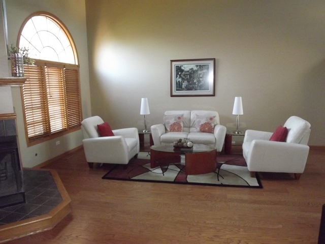 180 Grove Court, Unit 180 Lemont, IL 60439 - Photo 3 of 22 a living room with furniture and a large window