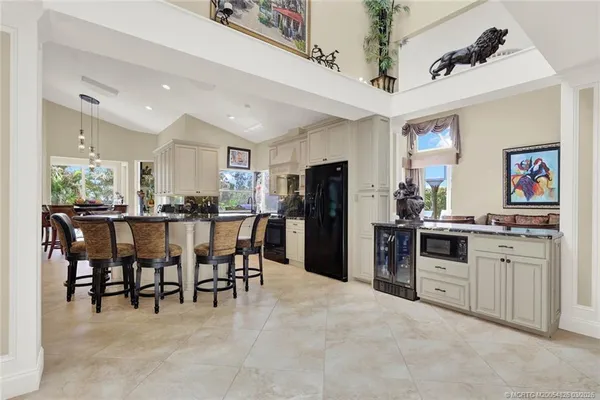 a kitchen with stainless steel appliances granite countertop a stove and a refrigerator
