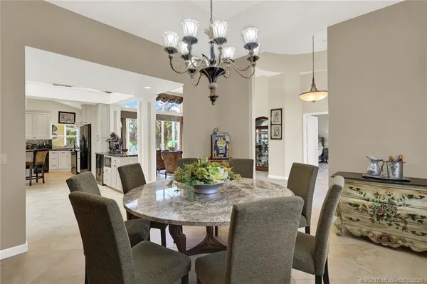 a kitchen with sink refrigerator and cabinets