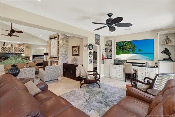 a bedroom with furniture and a flat screen tv
