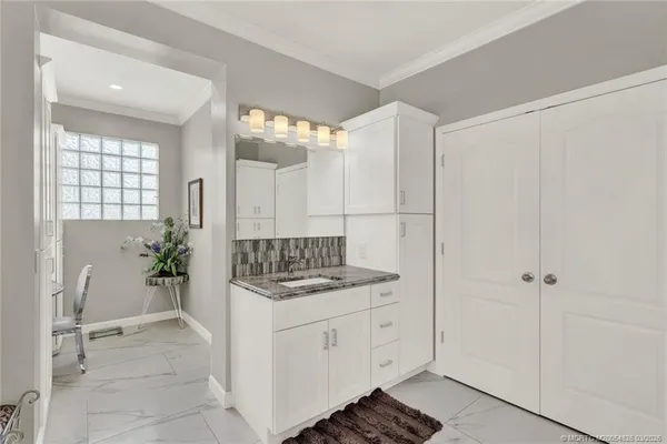 a view of a swimming pool with sitting area