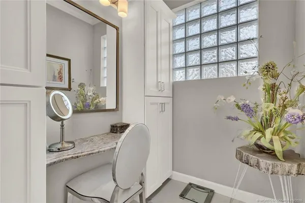 a view of a backyard with a patio and outdoor seating