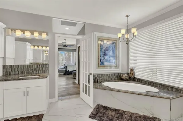 a view of a house with sitting area and swimming pool