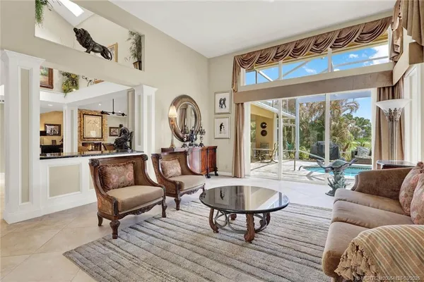 an aerial view of residential houses with outdoor space and swimming pool