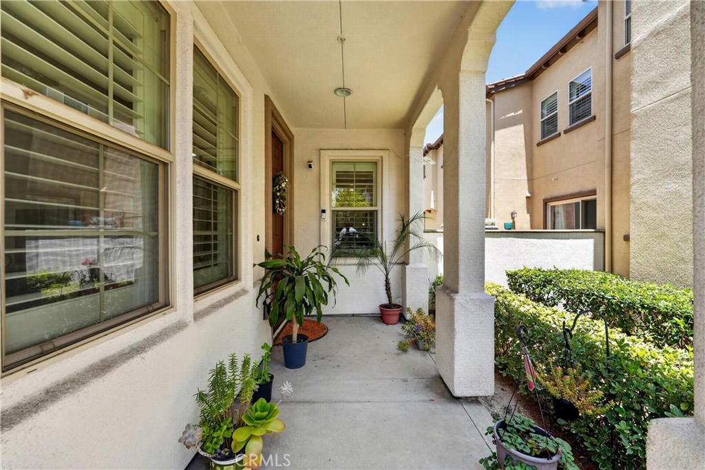 849 The Promenade, Unit D Azusa, CA 91702 - Photo 5 of 37 a potted plant in front of a building