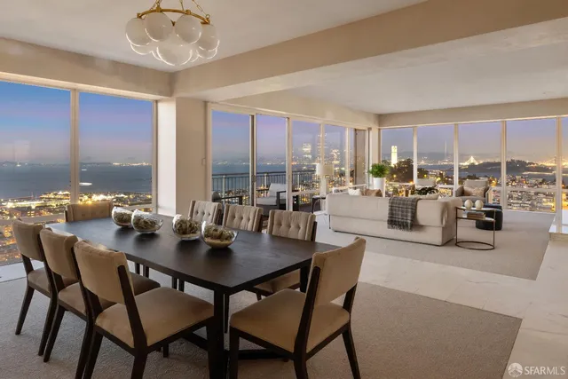 a view of a dining room with furniture window and outside view