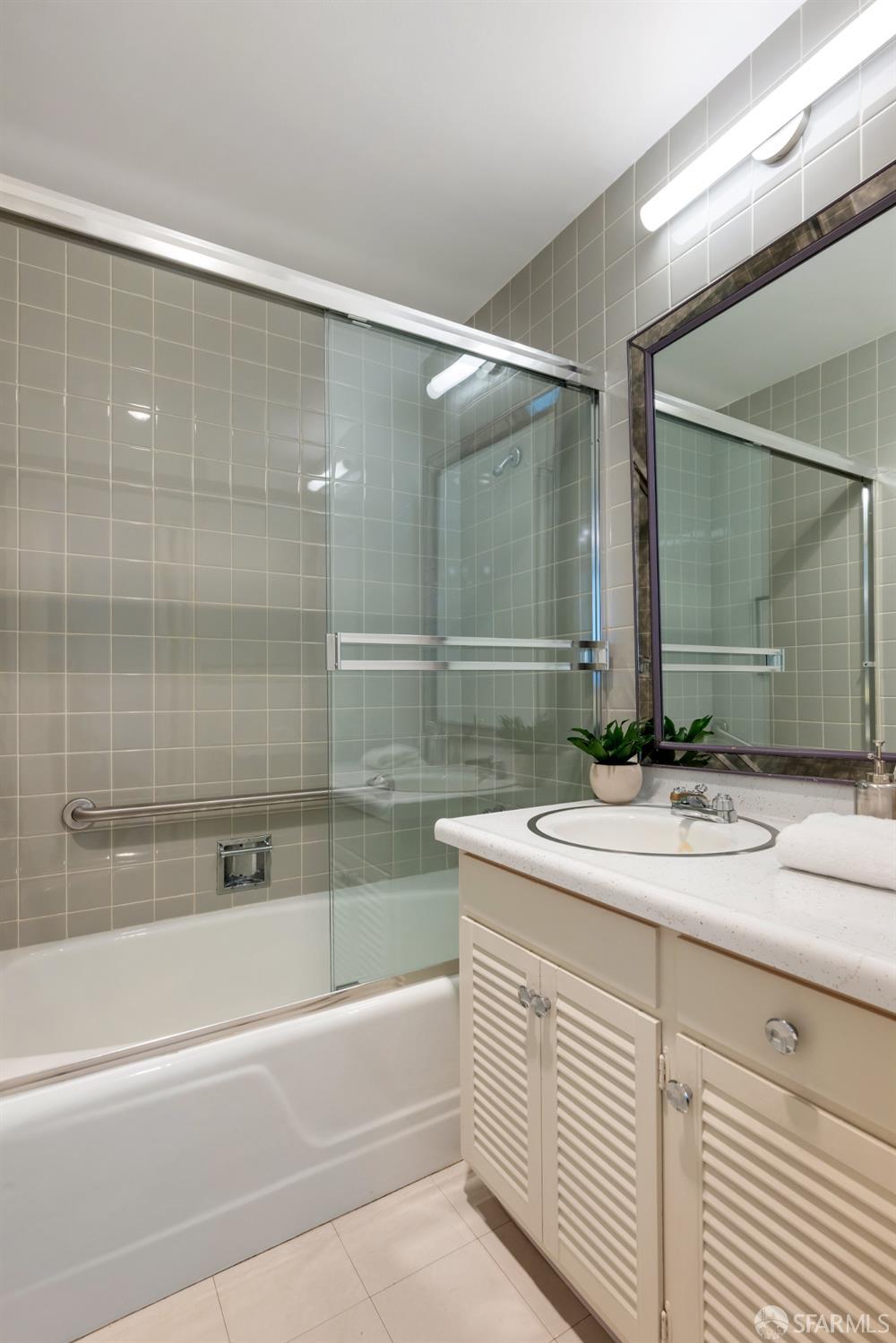 1750 Taylor Street, Unit 1001 San Francisco, CA 94133 - Photo 26 of 43 a bathroom with a sink and a mirror