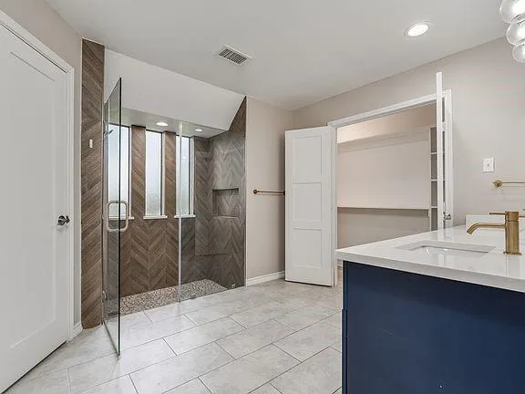 a kitchen with stainless steel appliances granite countertop a refrigerator sink and cabinets