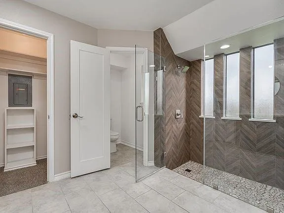 a bathroom with a shower and a sink
