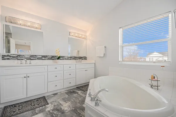a bath room with a sink and a mirror