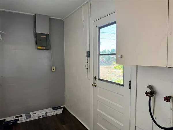 a bathroom with a window and a shower