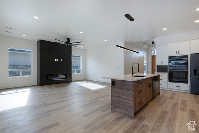 3145 Snow Cyn Road Hurricane, UT 84737 - Photo 36 of 38 Kitchen featuring open floor plan, modern cabinets, black appliances, light wood-style floors, and recessed lighting
