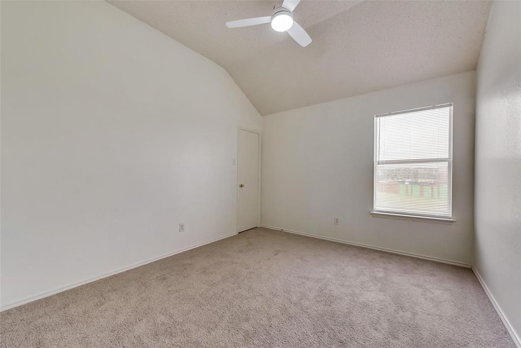 13401 Ponderosa Ranch Road Fort Worth, TX 76262 - Photo 16 of 22 an empty room with a window