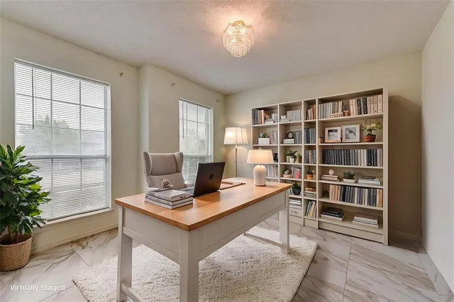 a workspace with furniture and window