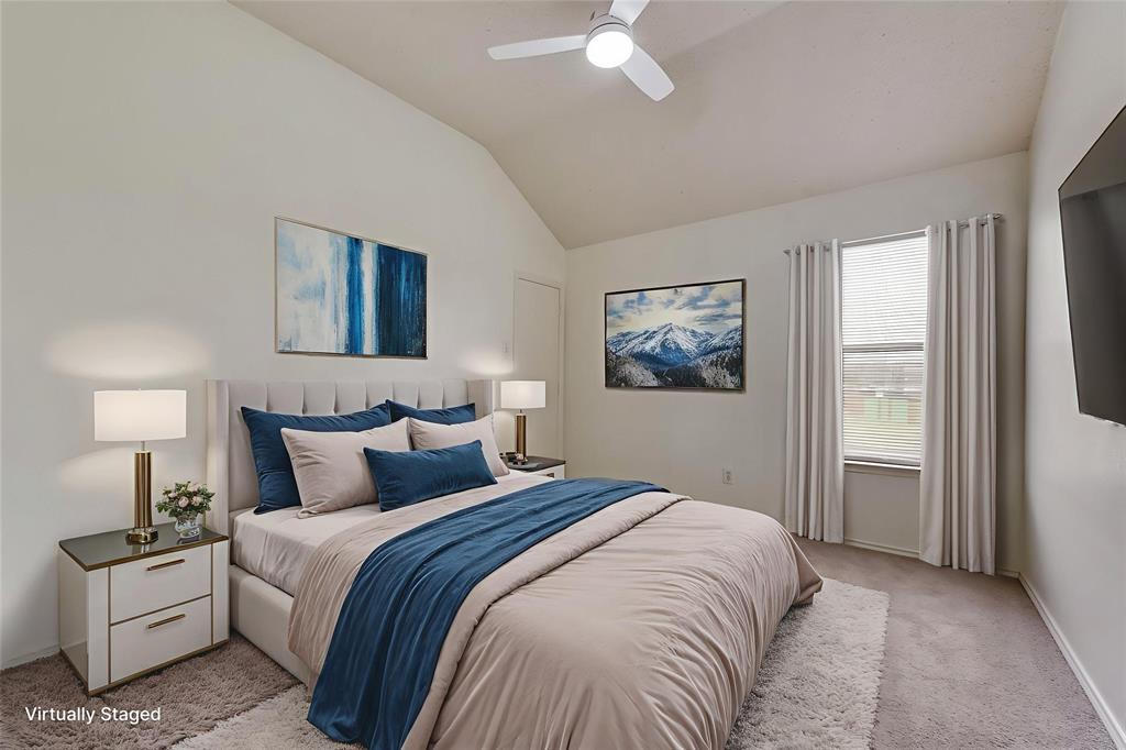 13401 Ponderosa Ranch Road Fort Worth, TX 76262 - Photo 10 of 22 a bedroom with a bed and a chandelier