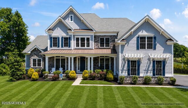 66 Windermere Road Lincroft, NJ 07738 - Photo 1 of 48 a front view of a house with a yard