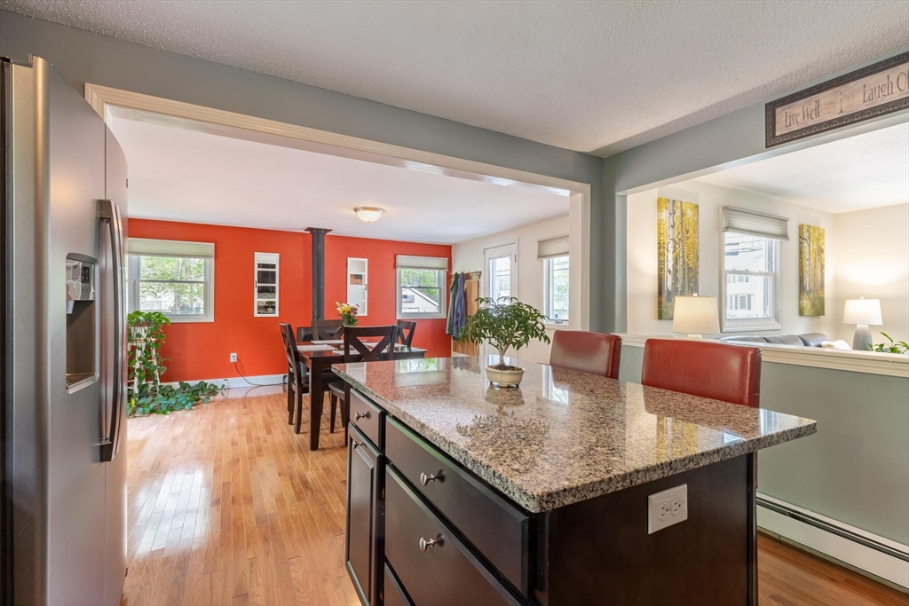 70 Parham Road Tyngsboro, MA 01879 - Photo 17 of 40 a dining table with chairs and wooden floor
