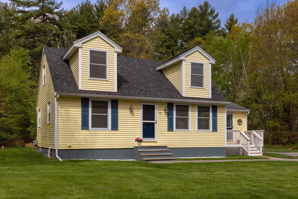 70 Parham Road Tyngsboro, MA 01879 - Photo 2 of 40 a front view of a house with a yard