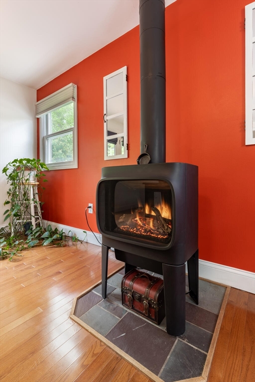 70 Parham Road Tyngsboro, MA 01879 - Photo 22 of 40 a living room with furniture and a fireplace
