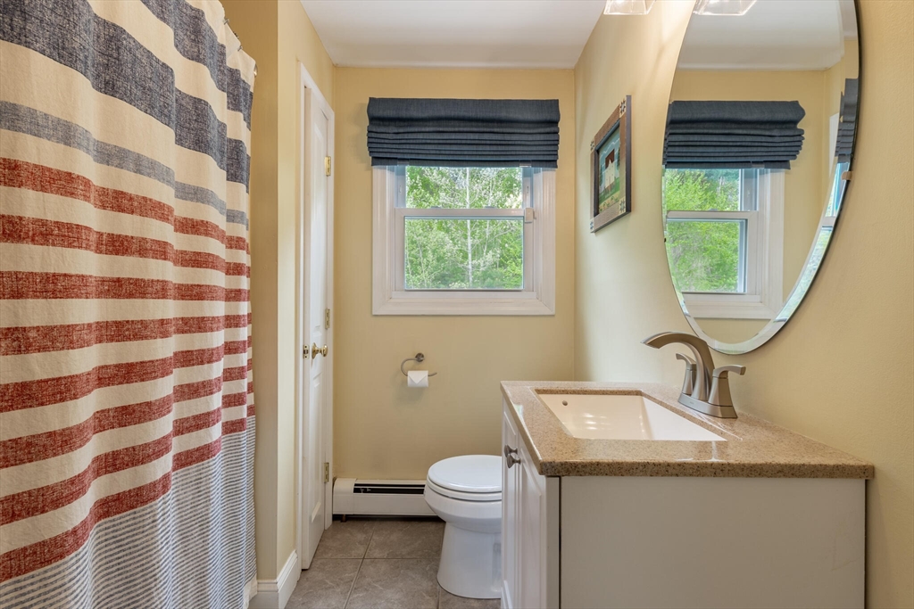 70 Parham Road Tyngsboro, MA 01879 - Photo 23 of 40 a bathroom with a granite countertop sink toilet and shower