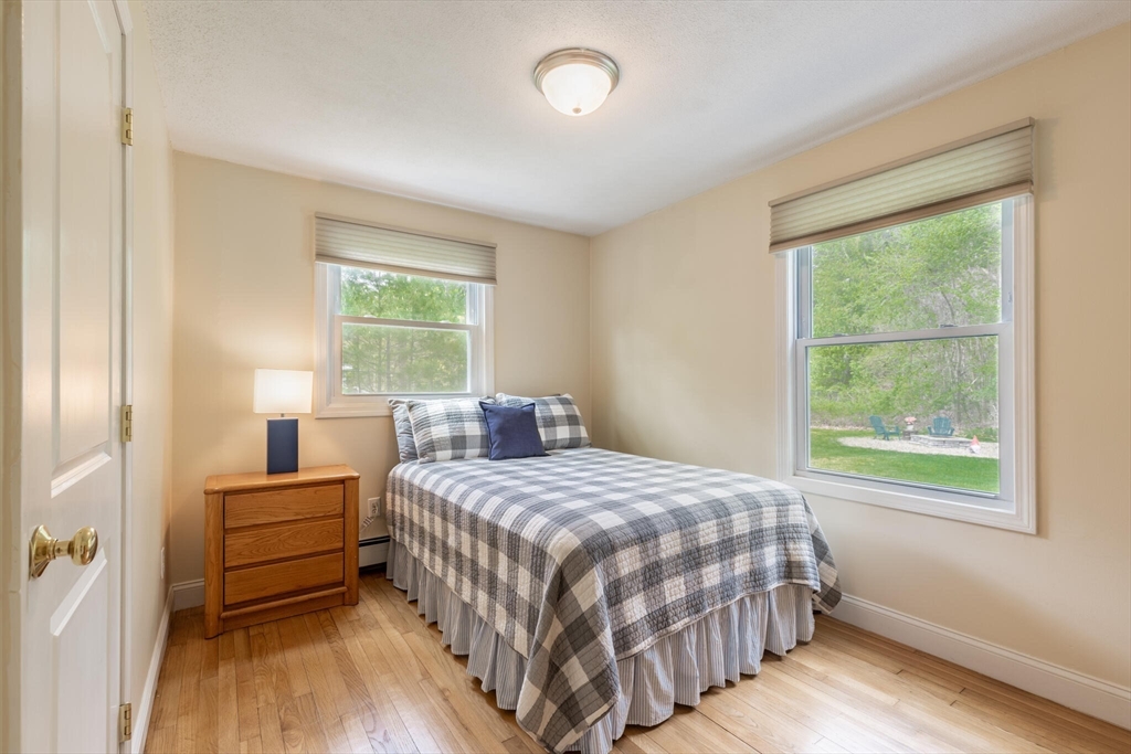 70 Parham Road Tyngsboro, MA 01879 - Photo 25 of 40 a bedroom with a bed and wooden floor