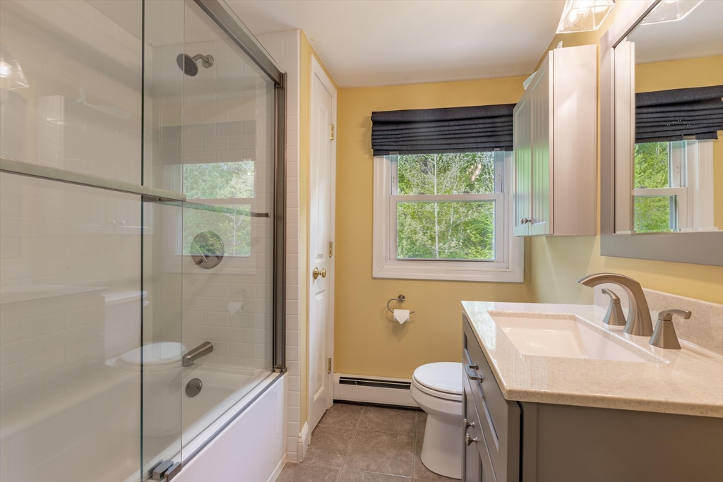 70 Parham Road Tyngsboro, MA 01879 - Photo 28 of 40 a bathroom with a sink toilet and shower