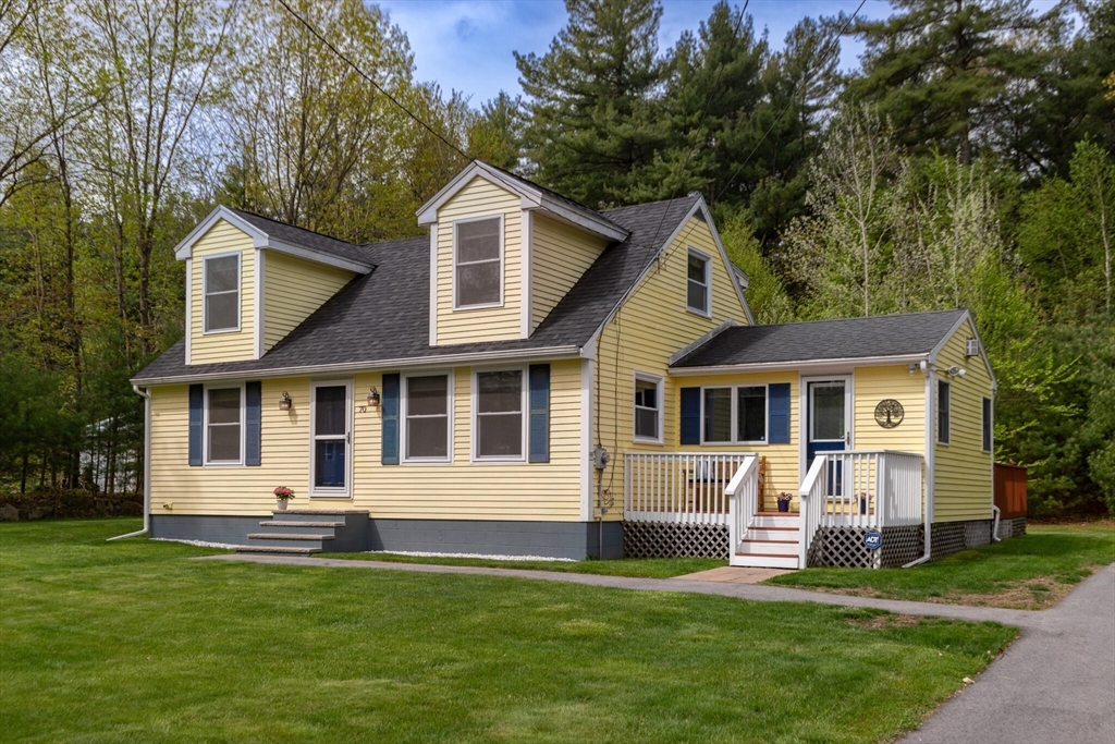 70 Parham Road Tyngsboro, MA 01879 - Photo 3 of 40 a front view of a house with a yard