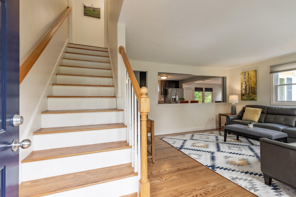 70 Parham Road Tyngsboro, MA 01879 - Photo 6 of 40 a living room with furniture and a wooden floor