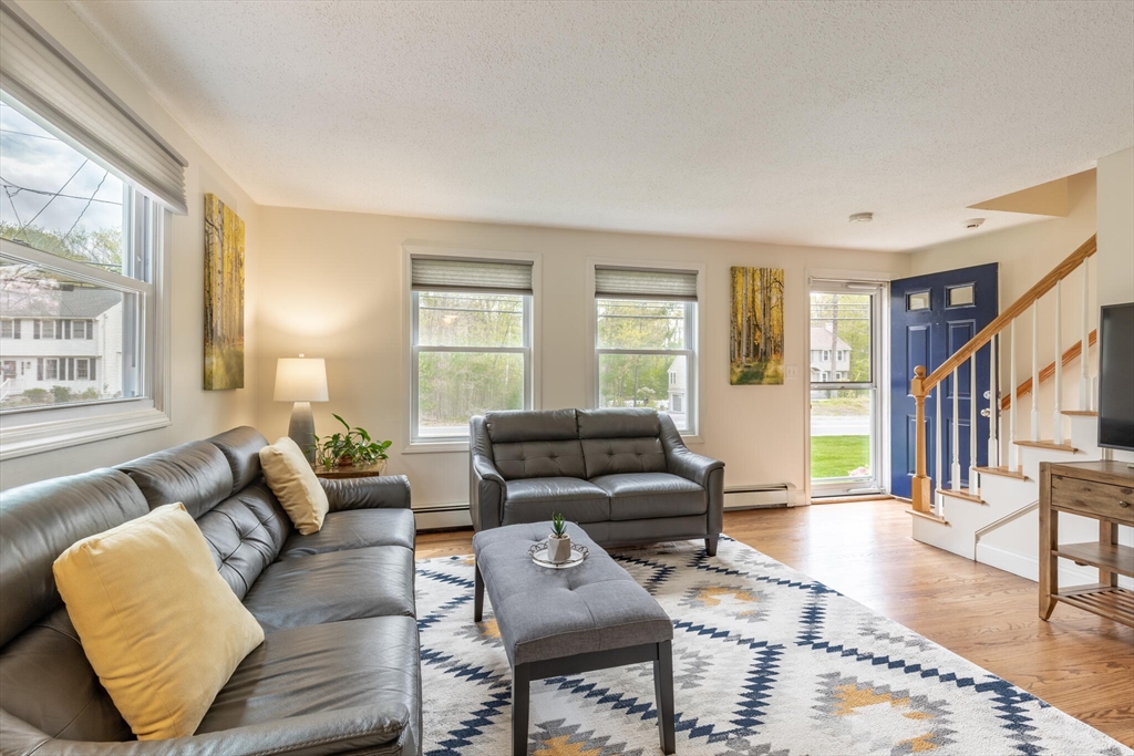 70 Parham Road Tyngsboro, MA 01879 - Photo 7 of 40 a living room with furniture and a window