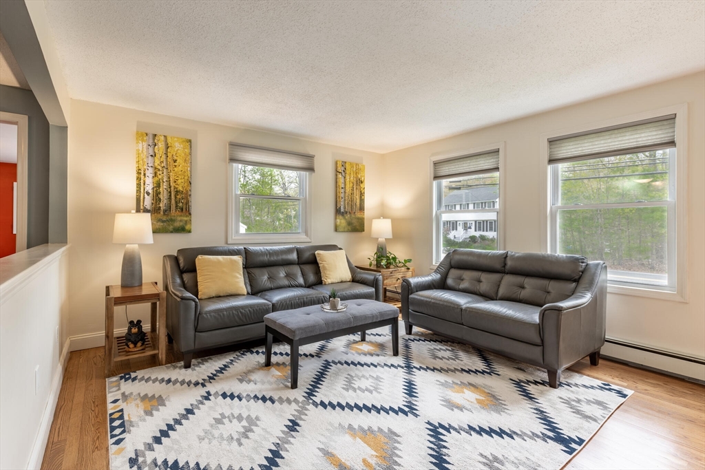 70 Parham Road Tyngsboro, MA 01879 - Photo 8 of 40 a living room with furniture and a window