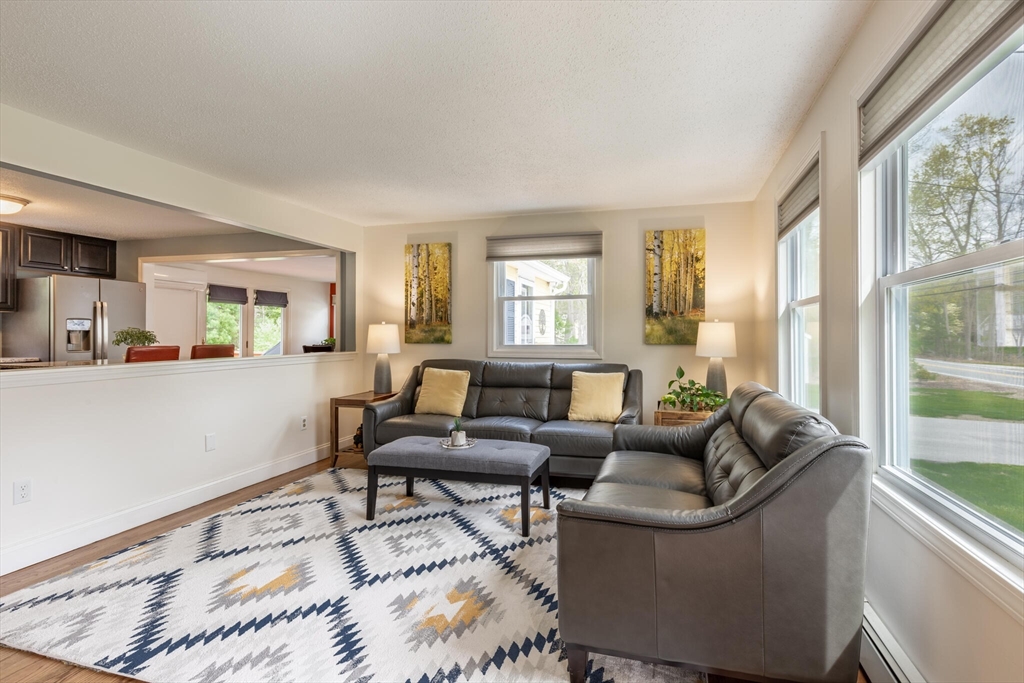 70 Parham Road Tyngsboro, MA 01879 - Photo 9 of 40 a living room with furniture and a large window