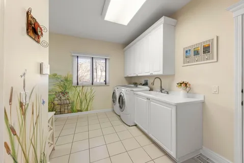 a bedroom with furniture and a chandelier