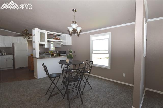 27055 Handle Road Calhan, CO 80808 - Photo 14 of 25 The separate dining room with plenty of room for a good sized dining table.