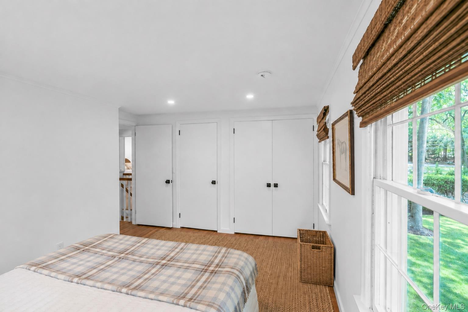 275 Pinewood Road Cutchogue, NY 11935 - Photo 23 of 45 Recessed lighting, wood-finish flooring, multiple windows, window treatments, and white interior doors