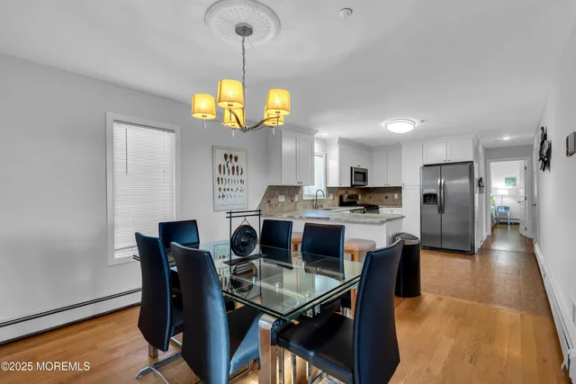 a view of dining table and chairs
