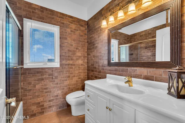 a bathroom with a shower and a sink