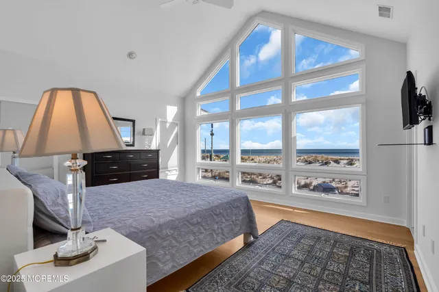 a bedroom with a bed and a view of bathroom