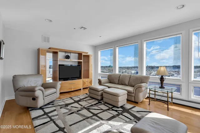 a living room with furniture and a lamp