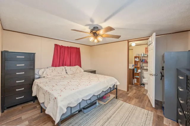 a bed room with a bed and a dresser