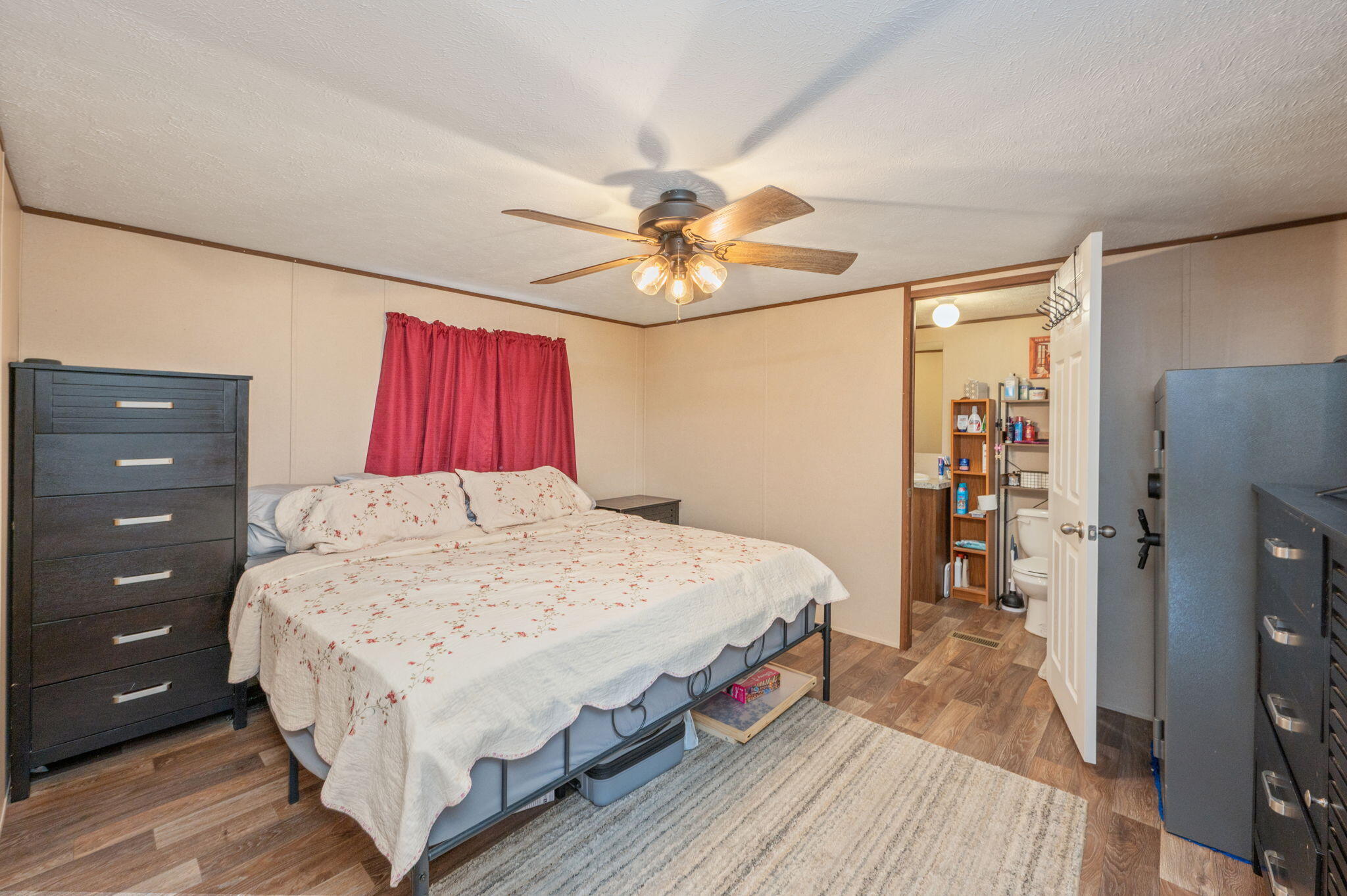 1424 East F Sanford Road Baker, FL 32531 - Photo 11 of 32 a bed room with a bed and a dresser