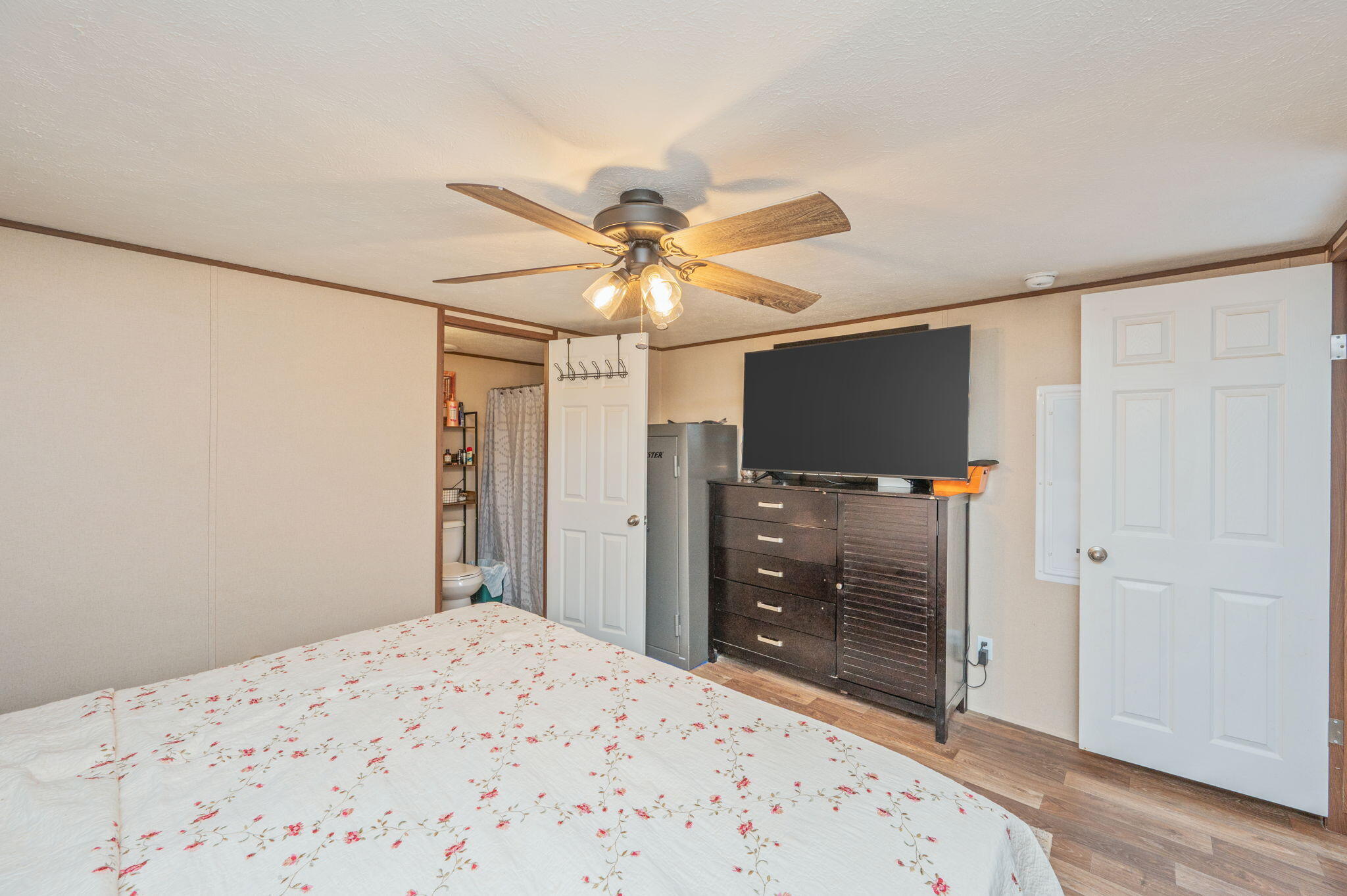 1424 East F Sanford Road Baker, FL 32531 - Photo 12 of 32 a bedroom with a bed and a flat screen tv