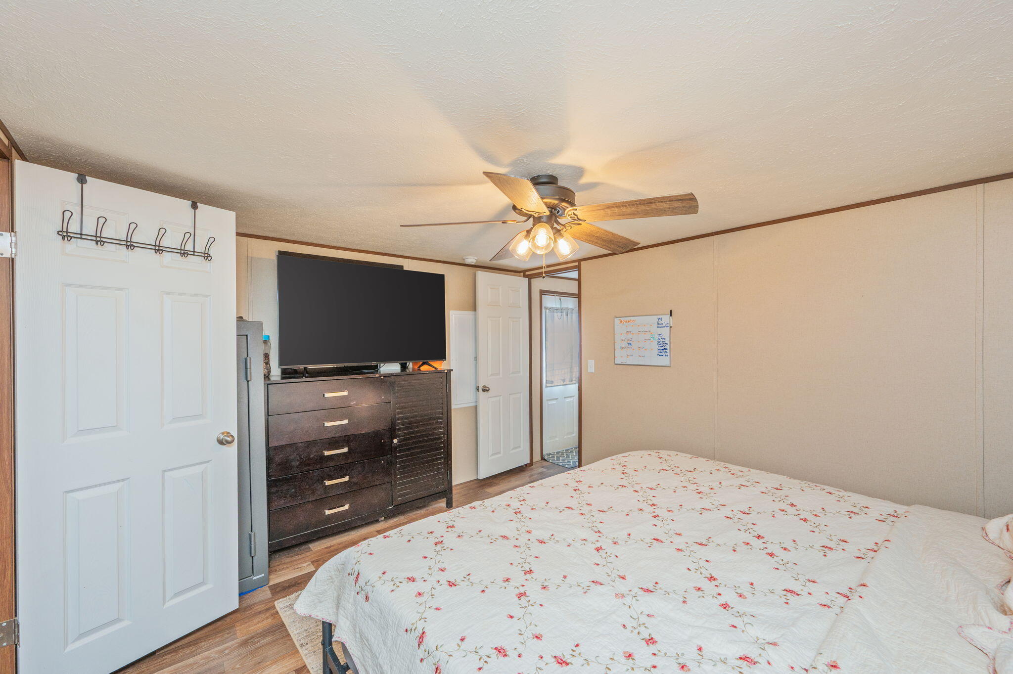 1424 East F Sanford Road Baker, FL 32531 - Photo 13 of 32 a bedroom with a bed and a flat screen tv