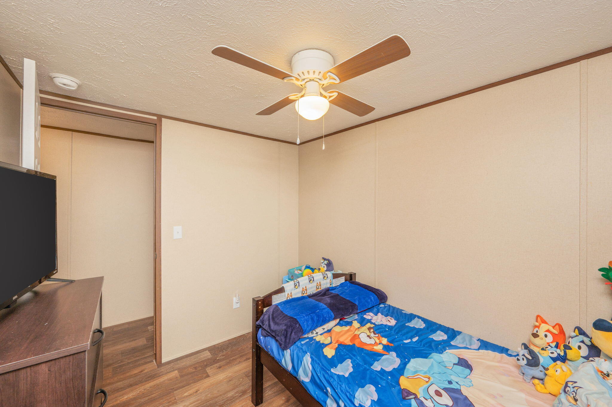 1424 East F Sanford Road Baker, FL 32531 - Photo 18 of 32 a bedroom with a bed and a chandelier