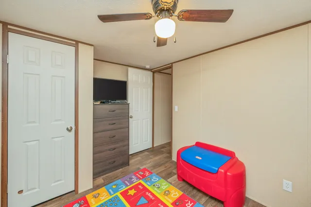 a white toilet sitting next to a shower curtain