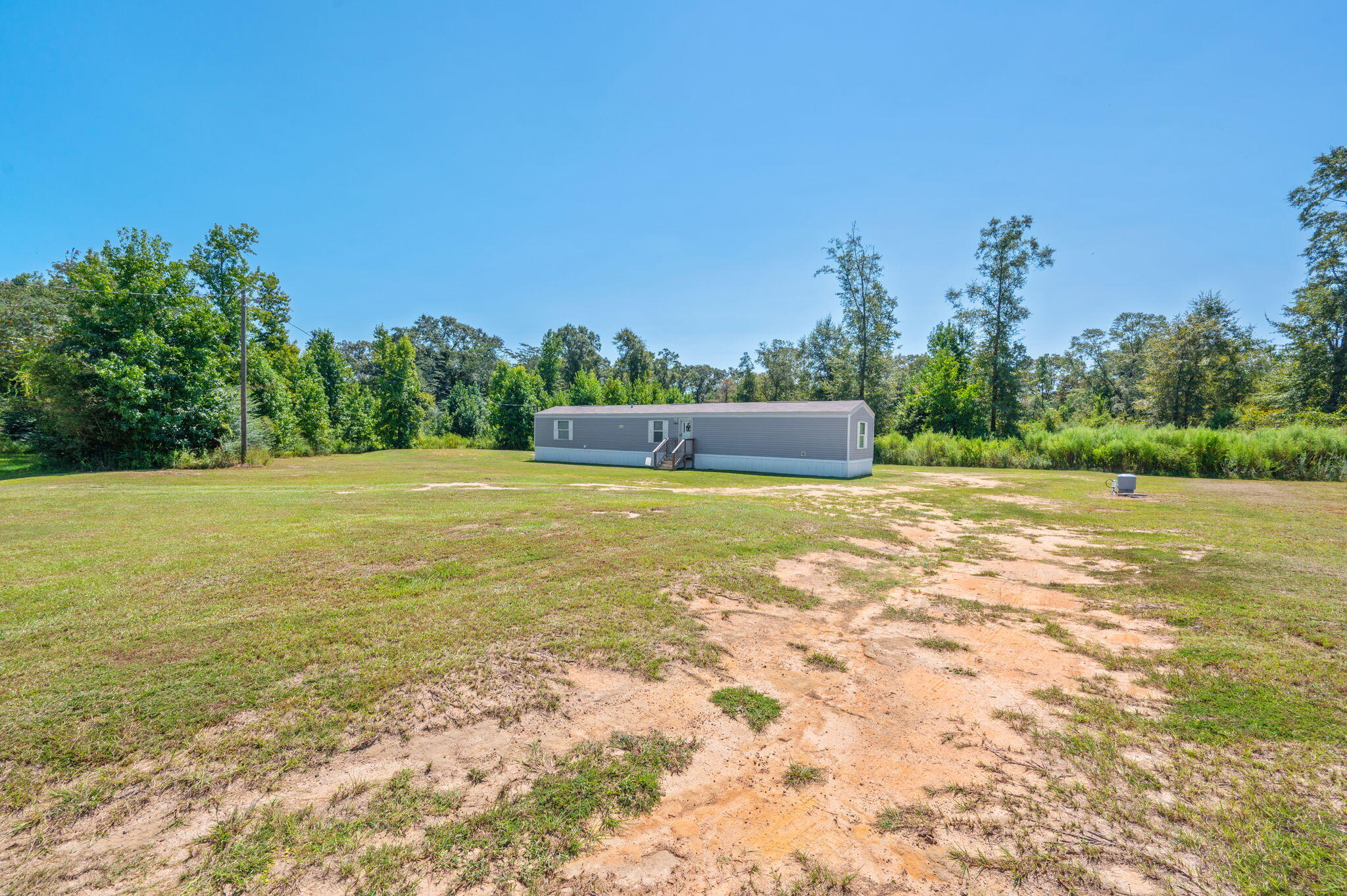 1424 East F Sanford Road Baker, FL 32531 - Photo 27 of 32 a view of a pool with an outdoor space and seating area