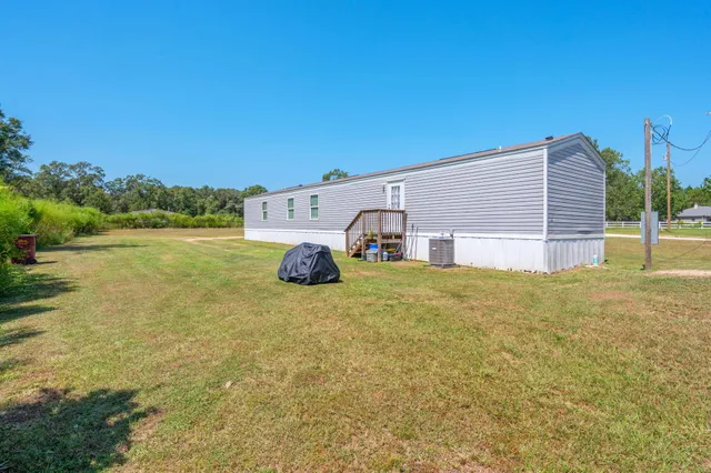 a view of a yard with an outdoor space