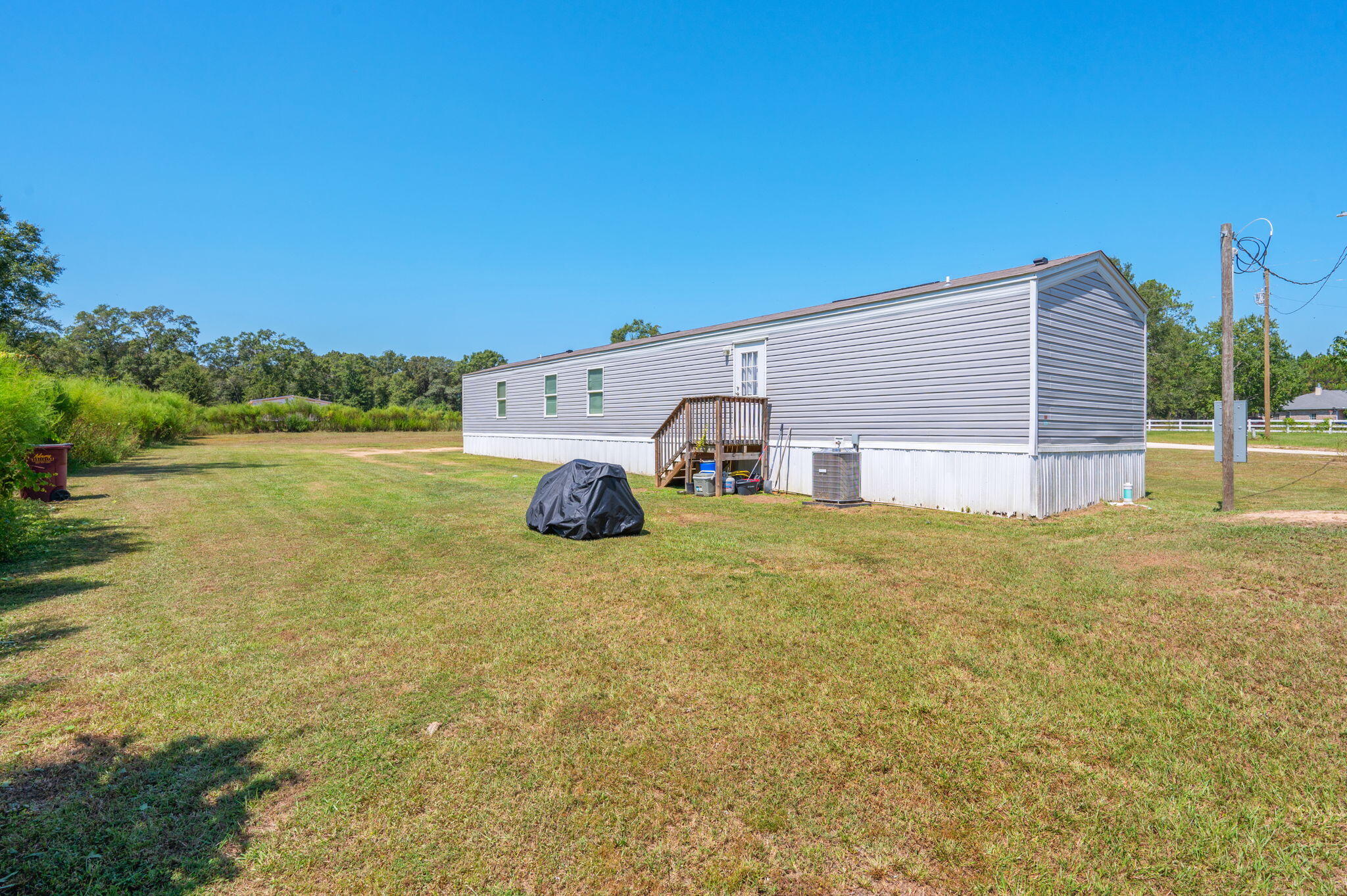 1424 East F Sanford Road Baker, FL 32531 - Photo 28 of 32 a view of a house with a yard