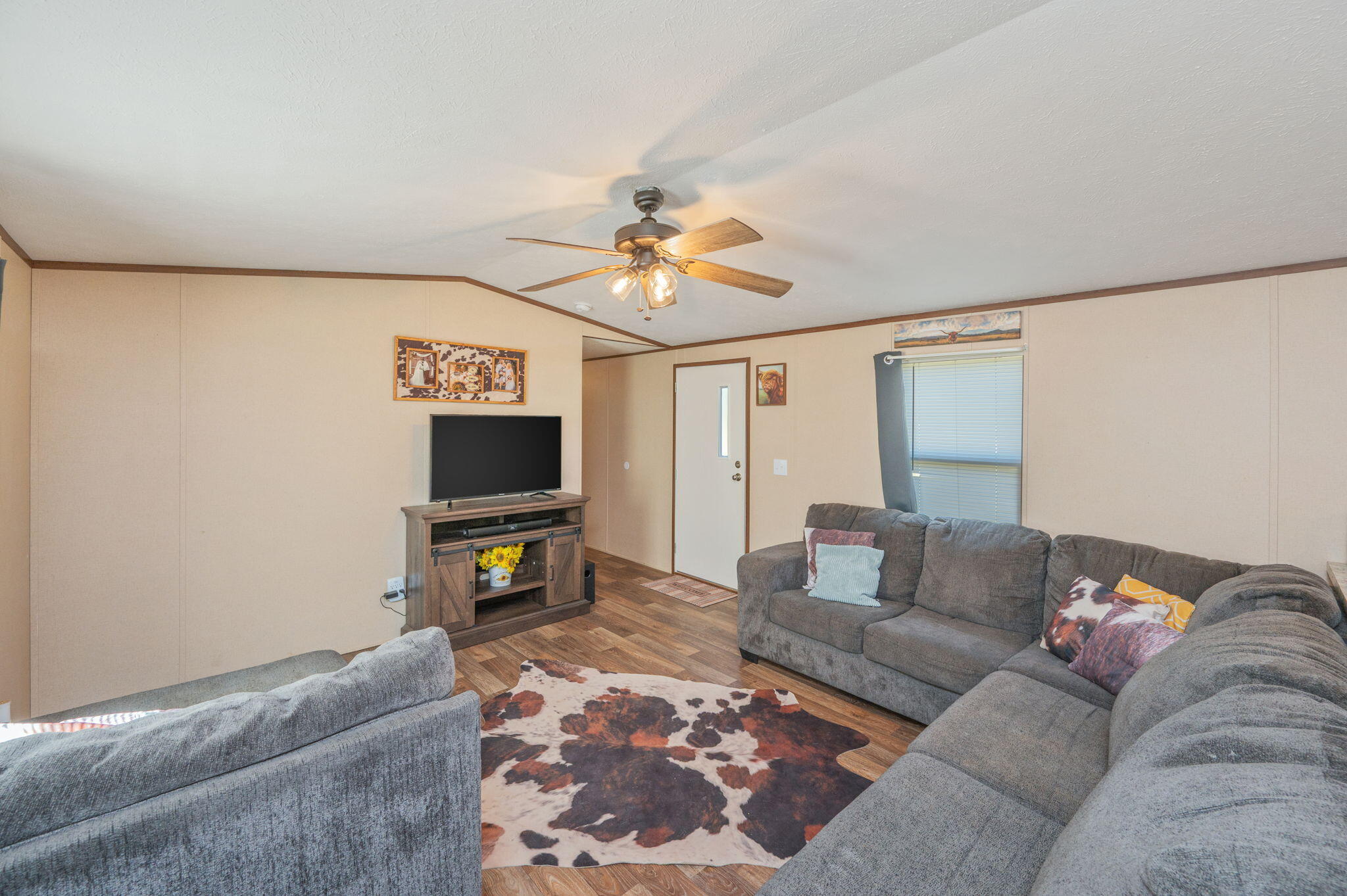 1424 East F Sanford Road Baker, FL 32531 - Photo 4 of 32 a living room with furniture and a flat screen tv